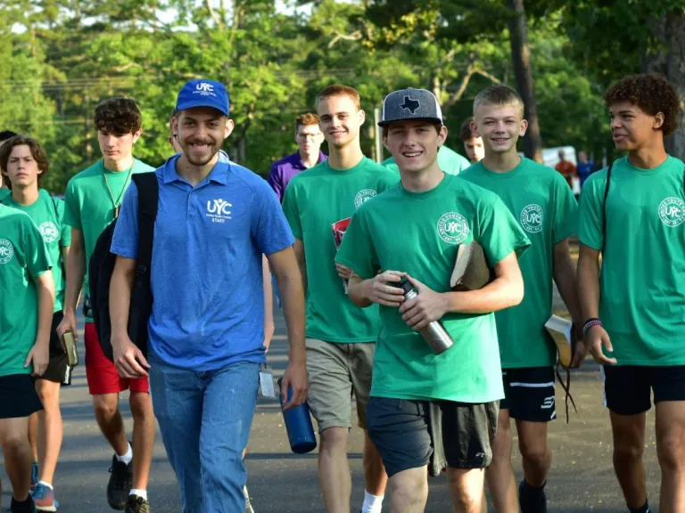 Camp Pinecrest a group of teenage boys and their counselors walking outdoors